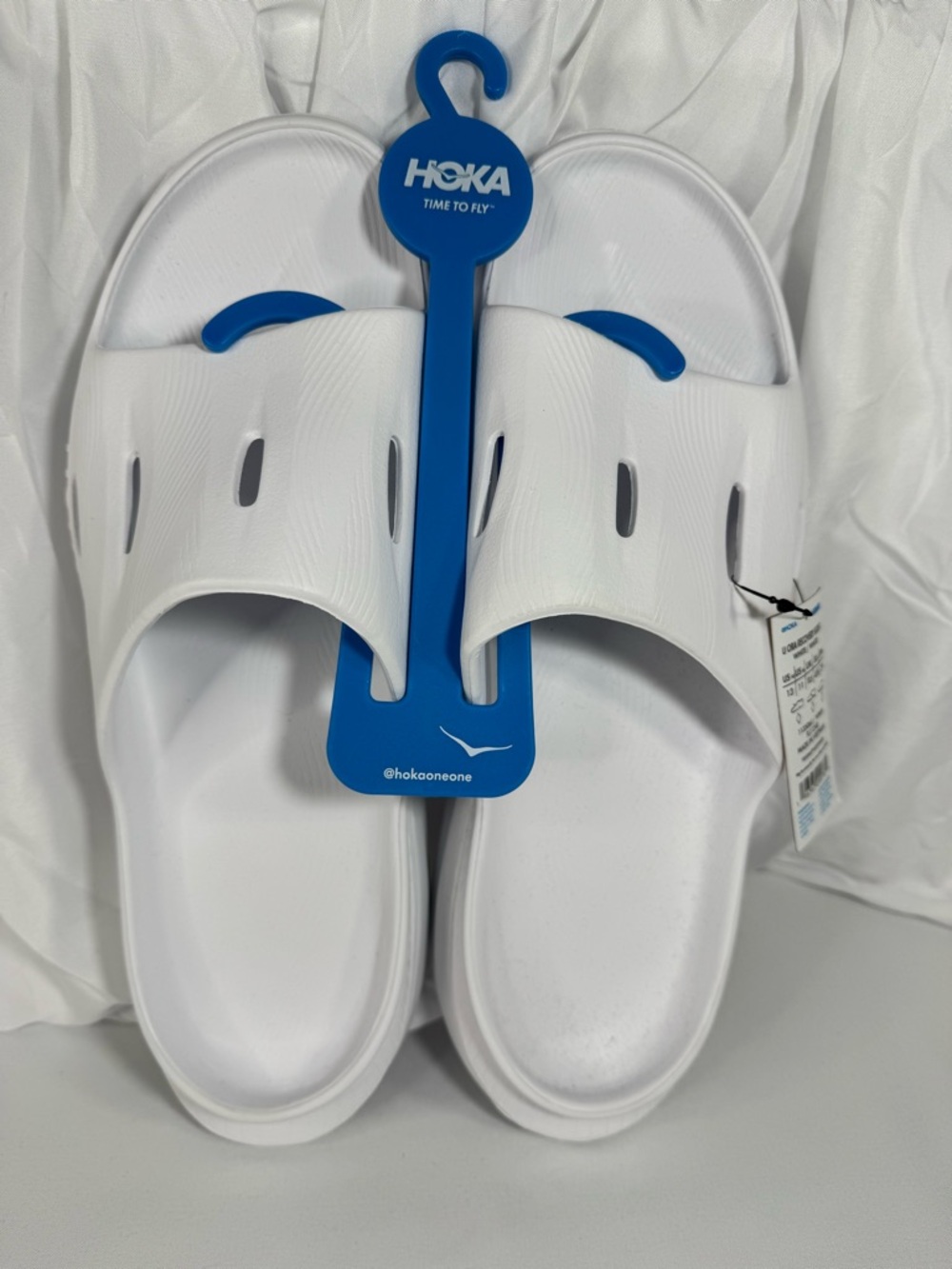 Hoka White Slide Sandals with Blue Hanger Accent